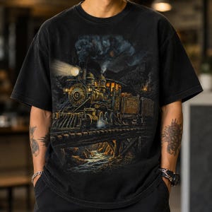 May include: A black short-sleeve t-shirt featuring a detailed graphic of a vintage steam locomotive numbered 42, labeled Ridge Road Southern, traveling across a wooden trestle bridge over a stream with smoke billowing into the dark night sky.