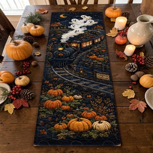 May include: A rectangular table runner featuring a dark blue night scene with a steam train emitting ghost-shaped smoke, surrounded by orange pumpkins and a sign reading Pumpkin Junction. The design includes detailed autumn foliage and glowing lanterns.