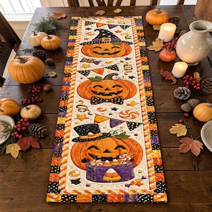 May include: A rectangular fabric table runner featuring a repeating Halloween pattern of orange jack-o'-lanterns wearing hats and bow ties, surrounded by candy corn, stars, and festive bunting, all framed by a black, orange, and white striped border.