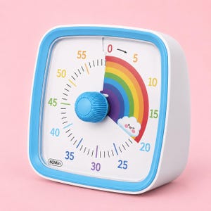 May include: A square visual timer with a white face, blue frame, and a central blue knob. The dial features a rainbow-coloured arc from 0 to 20 minutes, a small smiling cloud icon, and numbers 5 through 60 in various colours. The text 60Min is printed.