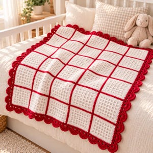 May include: A square crochet blanket featuring a grid of white textured squares separated by bold red lines. The blanket is finished with a decorative scalloped red border. The design consists of repeating square blocks with a waffle-like stitch pattern.