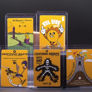 May include: Five collectible trading cards in clear plastic sleeves, featuring yellow backgrounds and cartoon-style illustrations. The cards are labelled Reliquary Tower, Sol Ring, Swiftfoot Boots, Lightning Greaves, and Command Tower with unique graphic designs.