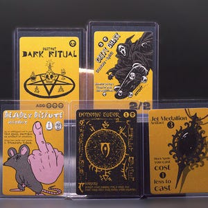 May include: Five rectangular trading cards in clear plastic protective sleeves. The cards feature yellow and black graphic designs with text including Dark Ritual, Crypt Ghast, Deadly Dispute, Demonic Tutor, and Jet Medallion, displaying various illustrations.