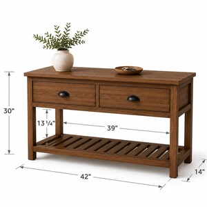 May include: A brown wooden console table with two drawers featuring black cup pulls and a slatted bottom shelf. Dimensions are 30 inches high, 42 inches wide, 14 inches deep, with a 39-inch wide shelf and 13.25-inch clearance under the drawers.