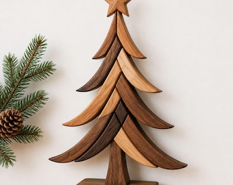 May include: A decorative Christmas tree sculpture crafted from alternating light and dark brown wood segments. The tree features a tiered, curved branch design and is topped with a five-pointed wooden star, all mounted on a rectangular base.