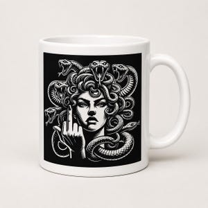 May include: A white ceramic mug featuring a black and white graphic illustration of a figure with snakes for hair, resembling Medusa, with a hand raised in a middle finger gesture. The design is centred on the front of the cylindrical mug.