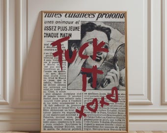 May include: A framed rectangular wall art print featuring a vintage black and white newspaper advertisement with a person applying cream to their face. The text "Fuck it" is written in bold, dark red paint across the centre, with a heart and xoxo.