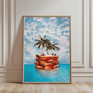 May include: A surreal art print featuring a multi-layered sandwich floating in the ocean. Two palm trees grow from the top bread slice, where small figures lounge. The sandwich has visible layers of red jam and tan filling, set against a blue sky.