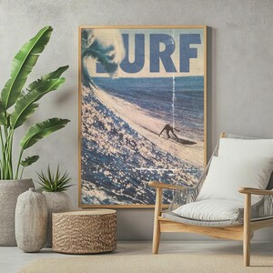 May include: A rectangular wall art print featuring a large blue wave and a surfer riding it, with the word SURF printed in large blue letters at the top. The artwork is enclosed in a thin wooden frame and displays a vintage, weathered aesthetic.