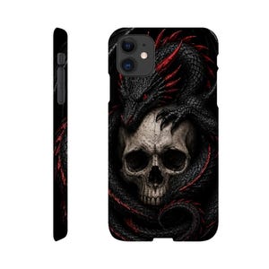 May include: A black phone case featuring a detailed graphic of a black dragon with red accents coiled around a human skull. The design covers the back and side of the case, showcasing the dragon's scales, red eyes, and sharp claws resting on the skull.