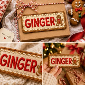 May include: A rectangular embroidered patch with a scalloped border featuring the word GINGER in bold red letters and a small gingerbread person icon with a red bow tie on a light beige background with a brown stitched edge.