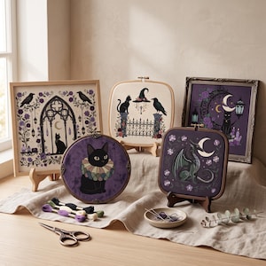 May include: A collection of five embroidery projects featuring gothic themes, including black cats, ravens, a dragon, and crescent moons in purple and cream tones. The set includes embroidery hoops, framed pieces, embroidery floss, and metal scissors.