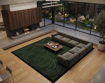 May include: A rectangular area rug featuring a deep green color with a textured, raised wave pattern and a solid black border. The rug is positioned on a light-colored wooden floor in a living room setting, centered beneath a low wooden coffee table.