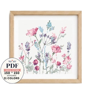 May include: A cross stitch pattern featuring a floral arrangement with pink, purple, and blue flowers and green foliage. The design is displayed in a light wood frame. A circular badge indicates it is a PDF digital pattern with 150 by 150 stitches.