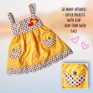 Natalie girls pinafore dress, pdf sewing pattern by Frocks & Frolics. High waist and sash with ties.  Here featuring a polka dot bodice and uni skirt in yello with lace detail. Double layer hem completes the look. Comes with free video tutorial.