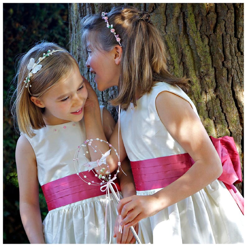 Flower girl dress pdf sewing pattern, cummerbund sash, big bow, classic flower girl frock, pink sash, cream bodice, covered buttons, rouleaux loop fastening. Free You Tube Video playlist. Back view of the handcovered cover buttons.