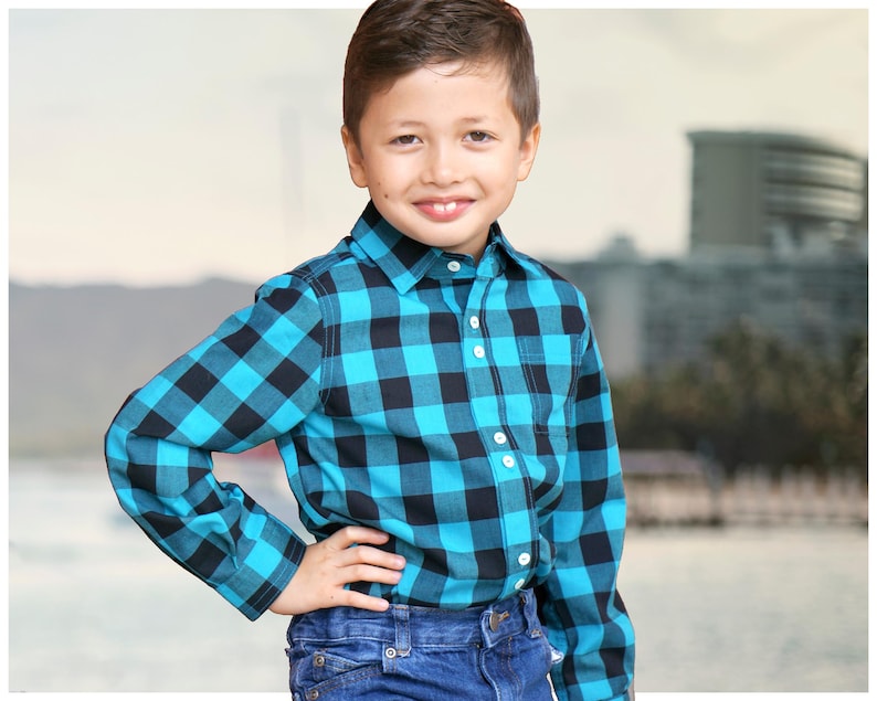 Cool shirt, pdf sewing pattern by Frocks & Frolics. Boys button down shirt for boys age 1-14. Here in a large blue and black Gingham fabric. Ithas cuffs, a stand up collar and classic yoke.