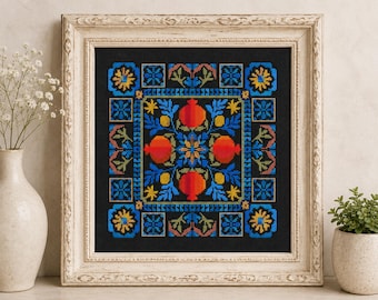 May include: A square cross-stitch embroidery featuring a symmetrical pattern of four orange pomegranates surrounded by blue and yellow floral motifs on a black background, encased in a decorative off-white wooden frame with ornate carvings.