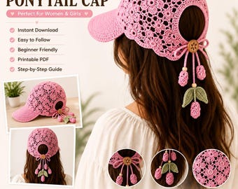 May include: A pink crochet ponytail cap featuring a floral lace pattern, a solid brim, and a back opening secured with a wooden button. The design includes dangling strawberry and leaf charms attached to the closure, presented as a digital pattern.