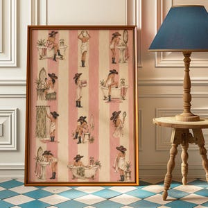 May include: A framed vertical wall art print featuring a repeating pattern of illustrations on a pink and cream striped background. The artwork depicts figures wearing cowboy hats and boots in various bathroom settings, including bathtubs and sinks.