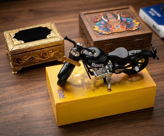 A hand-assembled metal miniature of an iconic bullet/café-racer motorcycle — the kind of desk piece that stops visitors mid-sentence.