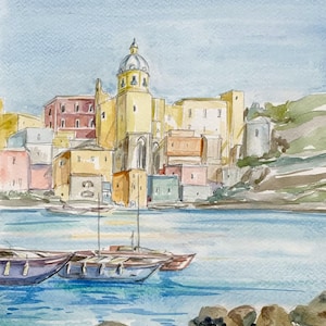May include: Watercolor painting of a colorful Italian village with a church steeple and boats in the foreground.