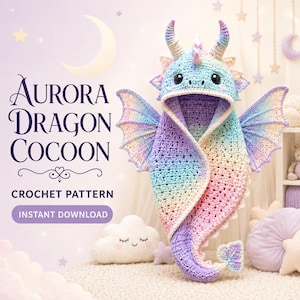 May include: A crochet dragon cocoon featuring a pastel rainbow gradient of blue, pink, and purple yarn. The hood includes two horns and black eyes. Text on the image reads: AURORA DRAGON COCOON CROCHET PATTERN INSTANT DOWNLOAD. The design has large wings.