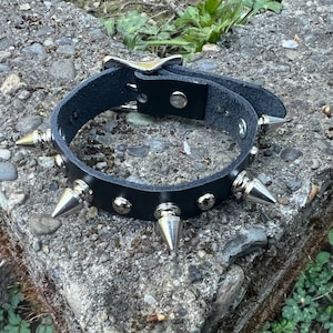 Spike bracelet with little round studs and 1/2” tree spikes