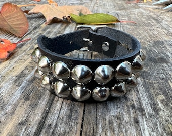 Studded punk bracelet with two rows of tiny cone studs