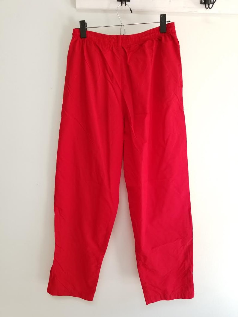 USA windbreaker pants 90s high waist athletic pants with zip up ankles size medium