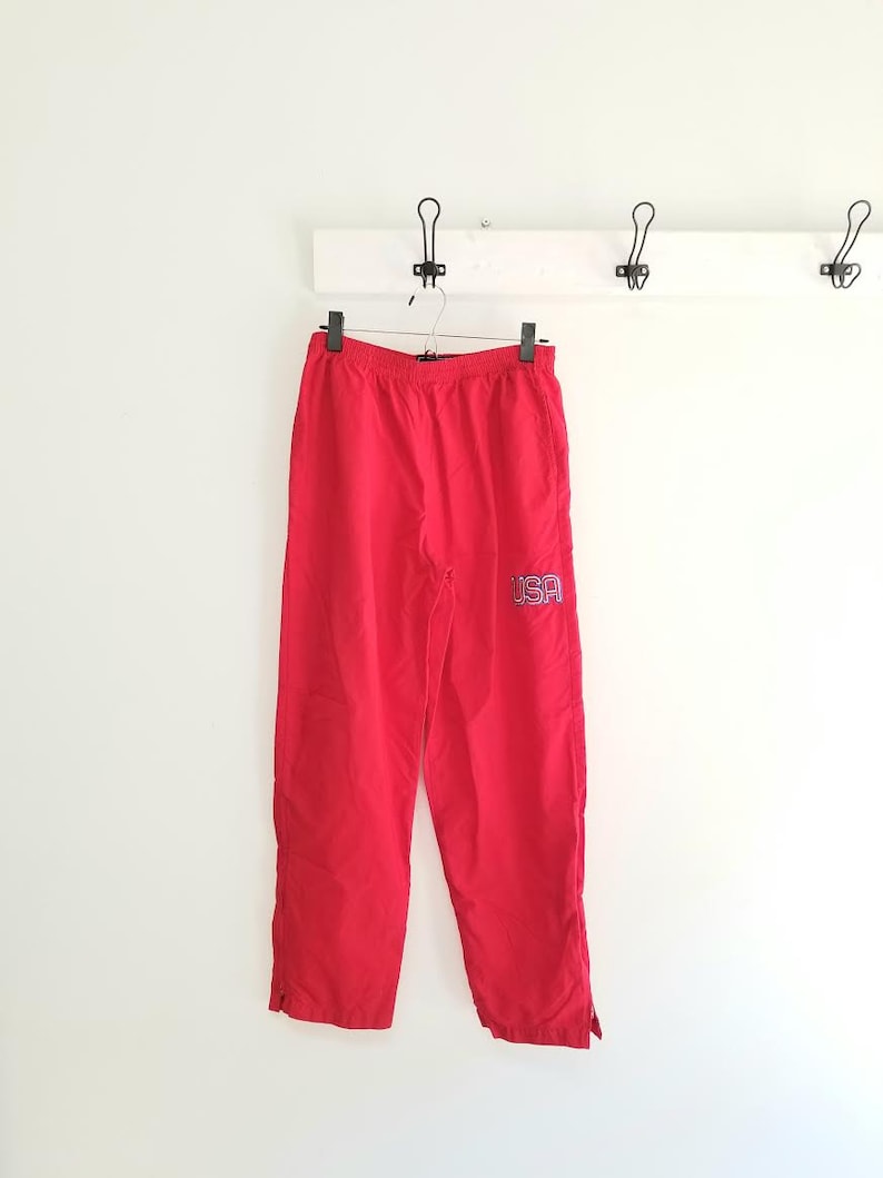 USA windbreaker pants 90s high waist athletic pants with zip up ankles size medium