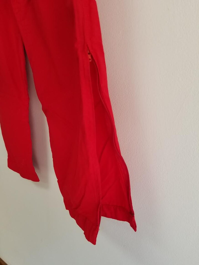 USA windbreaker pants 90s high waist athletic pants with zip up ankles size medium