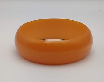 Vintage Bakelite Plastic Burnt Orange Low Dome Bangle Bracelet- Thick Plastic 1930s Bracelet- Curved Orange Bracelet- 7 1/2 inches- K#2022