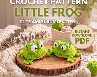 May include: A digital crochet pattern for a little frog amigurumi, featuring text that reads CROCHET PATTERN LITTLE FROG CUTE AMIGURUMI PATTERN INSTANT DOWNLOAD PDF MAKE YOUR OWN LITTLE FROG. Two green crocheted frogs with white eyes sit on a wood slice.