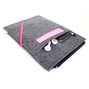 May include: A gray felt laptop sleeve with a pink felt pocket and a pink zipper pull. The sleeve has a black felt lining and a black zipper. The sleeve is shown with a phone and earbuds inside.