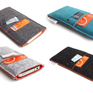 May include: Four felt phone cases with orange stitching. Each case has a slot for a credit card and a pocket for cash. The cases are in gray, teal, black, and gray.