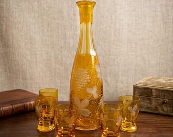 Antique Bohemian Amber Glass Decanter Set: Grape Motif, Five Cups, Ornate Stopper