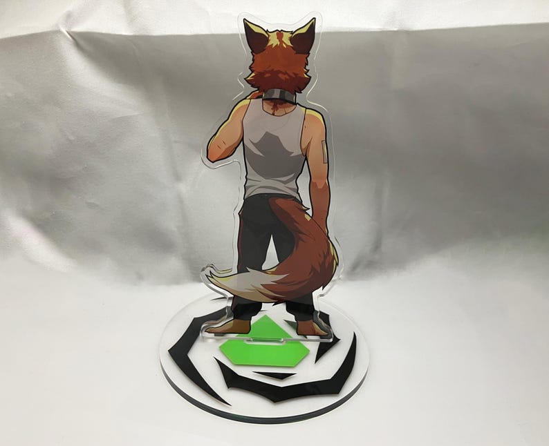 May include: A clear acrylic figure of a fox-like character, viewed from the back. The character wears a gray tank top, dark pants, and has a brown and white tail. The figure stands on a round base with a black and white design and a green accent.