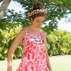 dragonfly motif on red tunic with white leggings