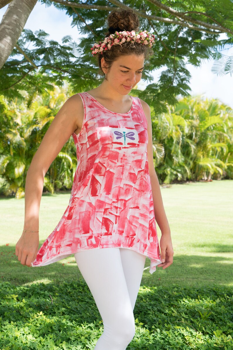dragonfly motif on red tunic with white leggings
