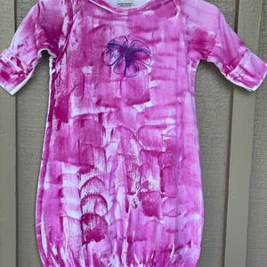 pink sleep sack with plumeria motif