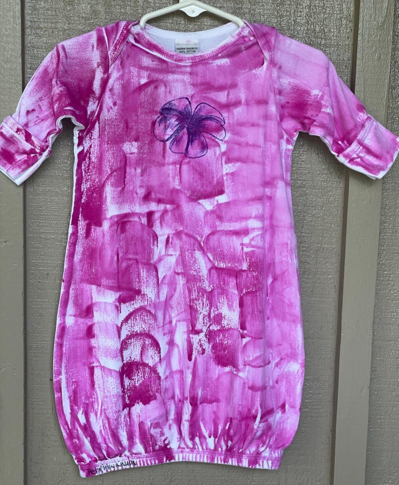pink sleep sack with plumeria motif