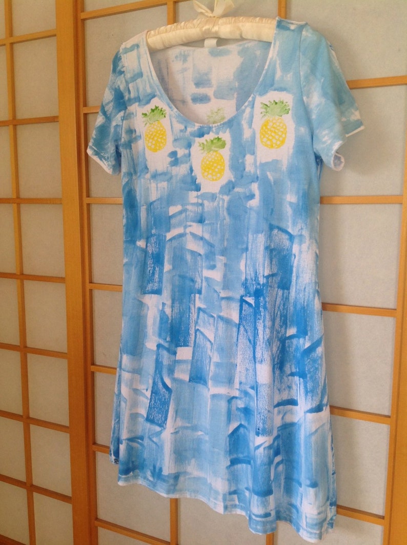 Pineapple lei on blue hand painted cotton jersey knee length dress