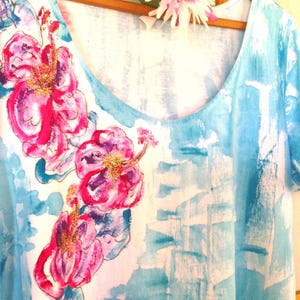 draped hibiscus on aqua