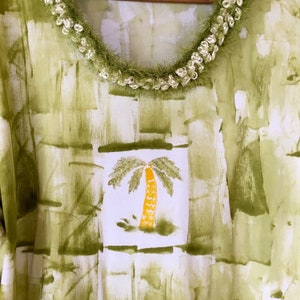 Avocado with palm tree (lei not included)