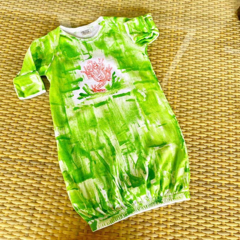 Frog sleep sack on green