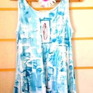 Aqua tunic with feather motif