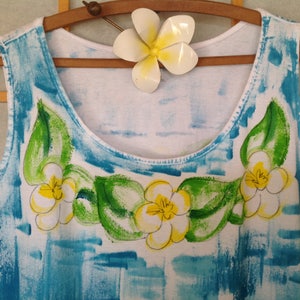 Plumeria lei on blue background