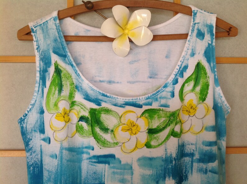 Plumeria lei on blue background