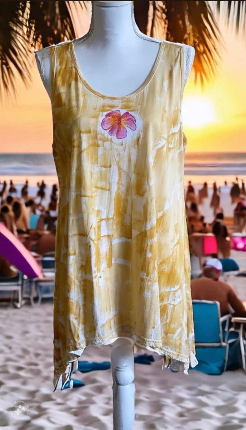 Light cotton tunic in neutral sand color with a plumeria.  Comes in tank or short sleeves.